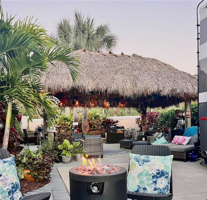 13575 Snook Circle Naples, FL 34114 - Photo 12 of 50 a view of outdoor sitting area with lots of fruit and vegetables