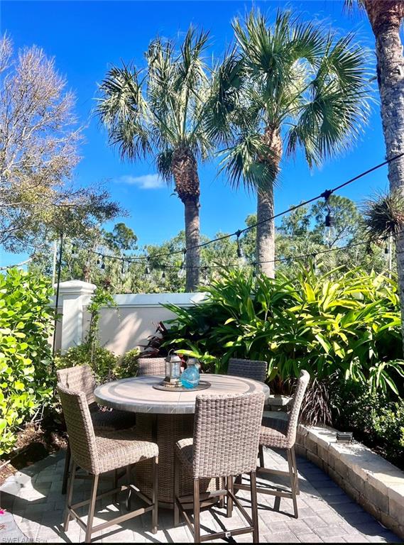 13575 Snook Circle Naples, FL 34114 - Photo 15 of 50 a view of a chairs and table in a patio