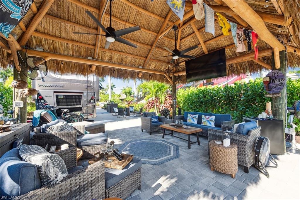 13575 Snook Circle Naples, FL 34114 - Photo 2 of 50 a view of a patio with couches and potted plants