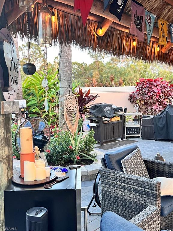 13575 Snook Circle Naples, FL 34114 - Photo 21 of 50 a outdoor living space with patio furniture