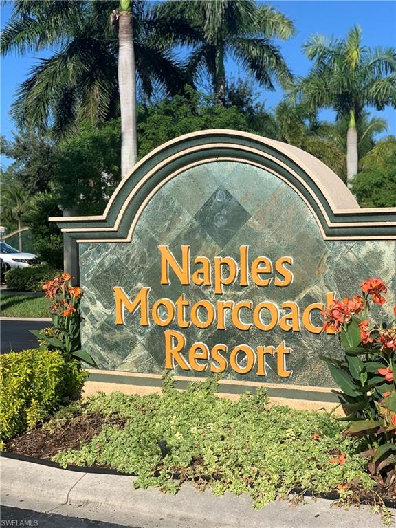 13575 Snook Circle Naples, FL 34114 - Photo 31 of 50 a view of sign board with flower plants