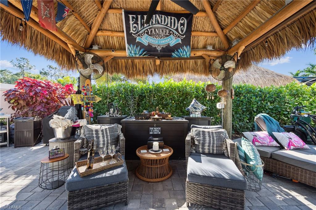 13575 Snook Circle Naples, FL 34114 - Photo 40 of 50 a view of a patio with couches and potted plants