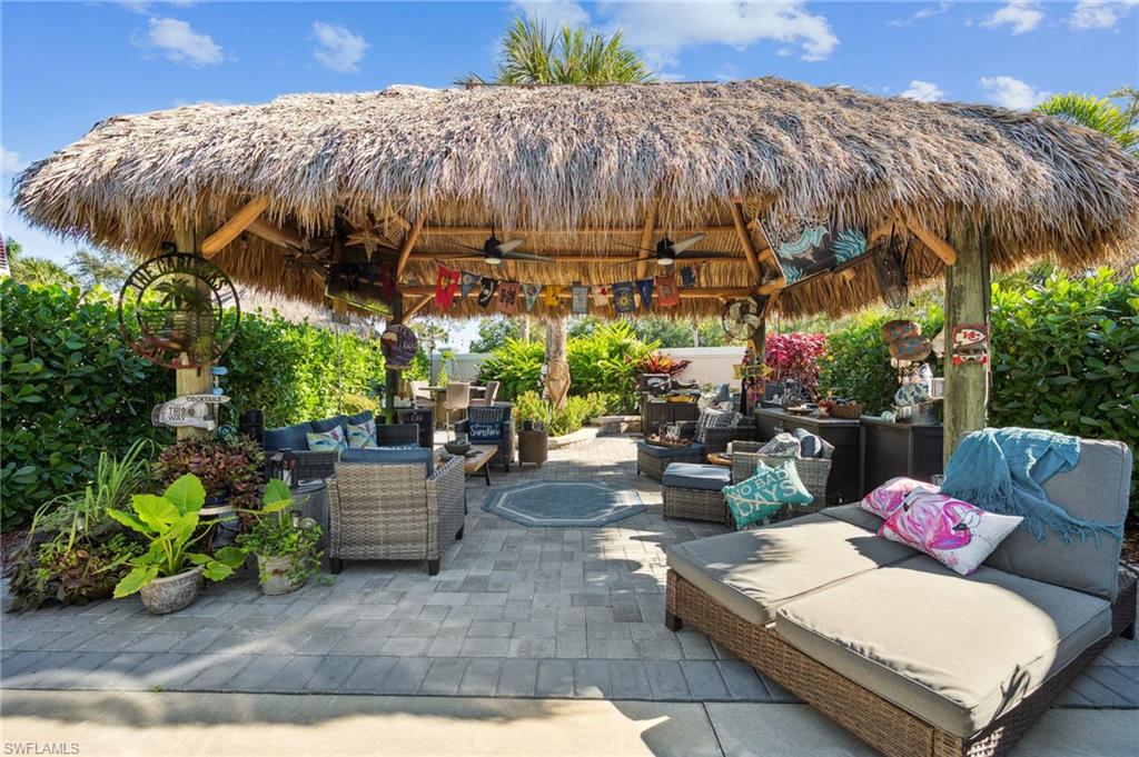 13575 Snook Circle Naples, FL 34114 - Photo 4 of 50 a view of a backyard with sitting area