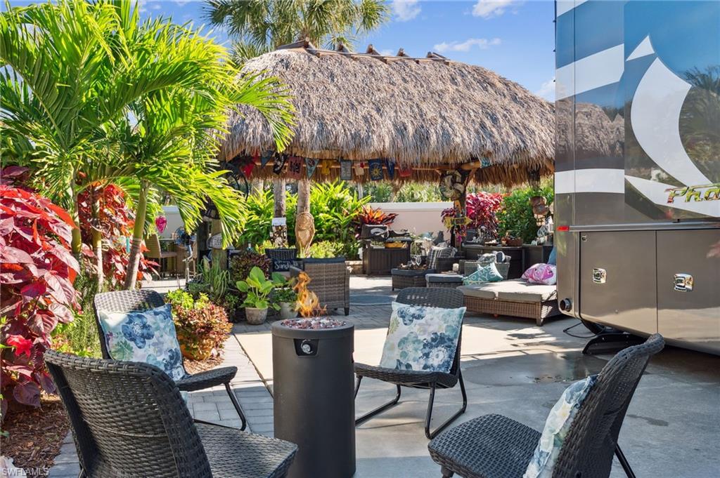 13575 Snook Circle Naples, FL 34114 - Photo 41 of 50 a view of a chairs and table in patio