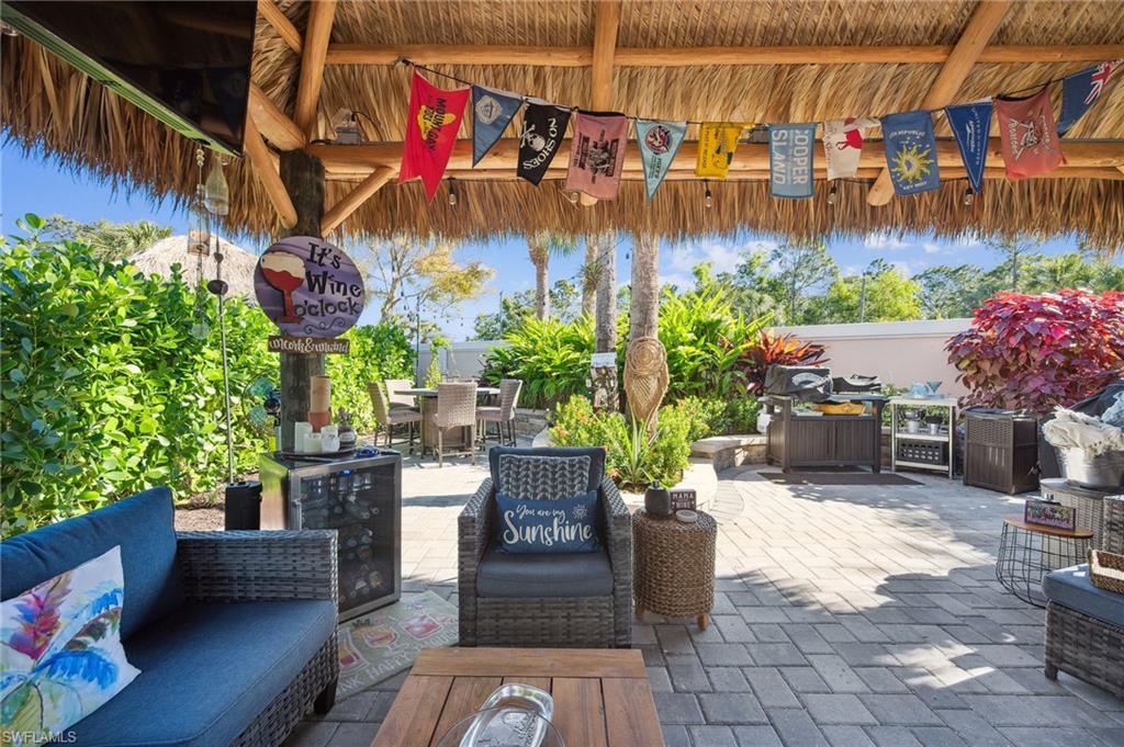 13575 Snook Circle Naples, FL 34114 - Photo 43 of 50 a view of a chairs and tables in patio
