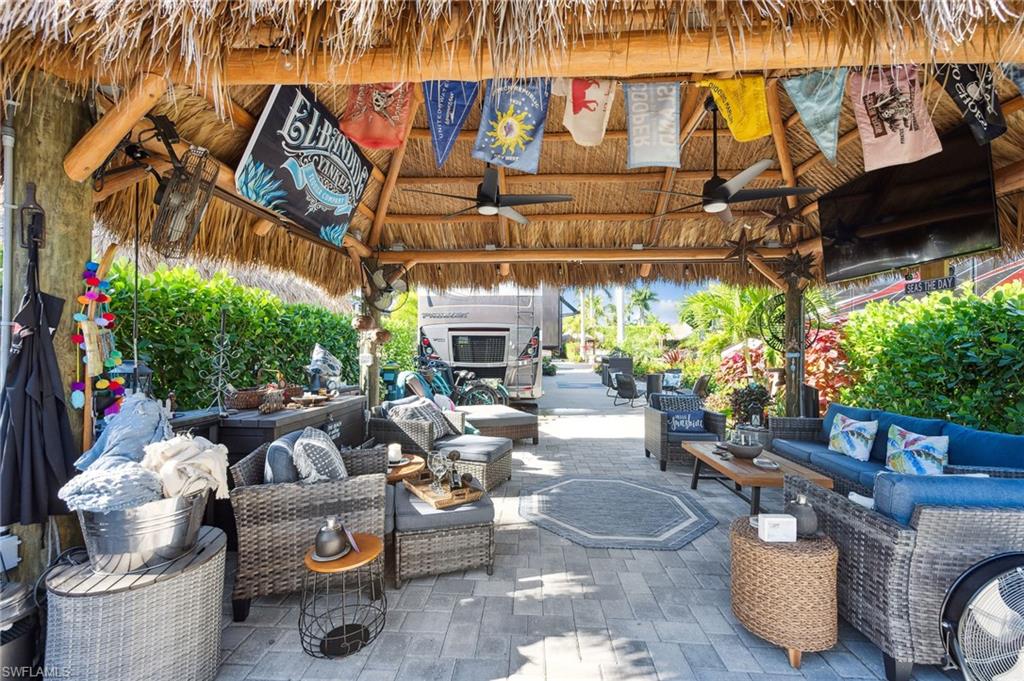 13575 Snook Circle Naples, FL 34114 - Photo 44 of 50 a view of a patio with couches and potted plants