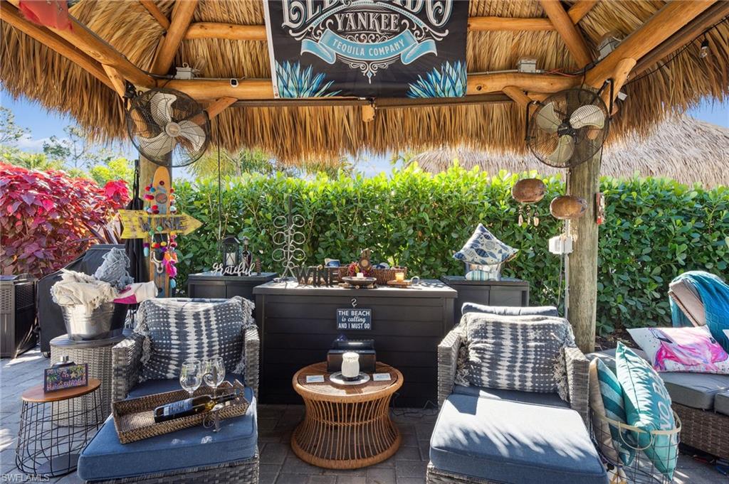 13575 Snook Circle Naples, FL 34114 - Photo 45 of 50 a outdoor living space with furniture and a potted plant