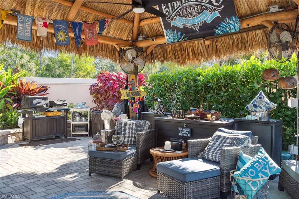 13575 Snook Circle Naples, FL 34114 - Photo 46 of 50 a outdoor living space with furniture and flowers