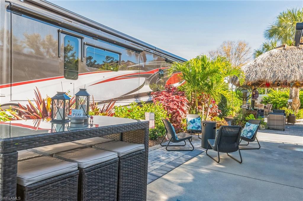 13575 Snook Circle Naples, FL 34114 - Photo 49 of 50 a view of a chairs and table in the patio