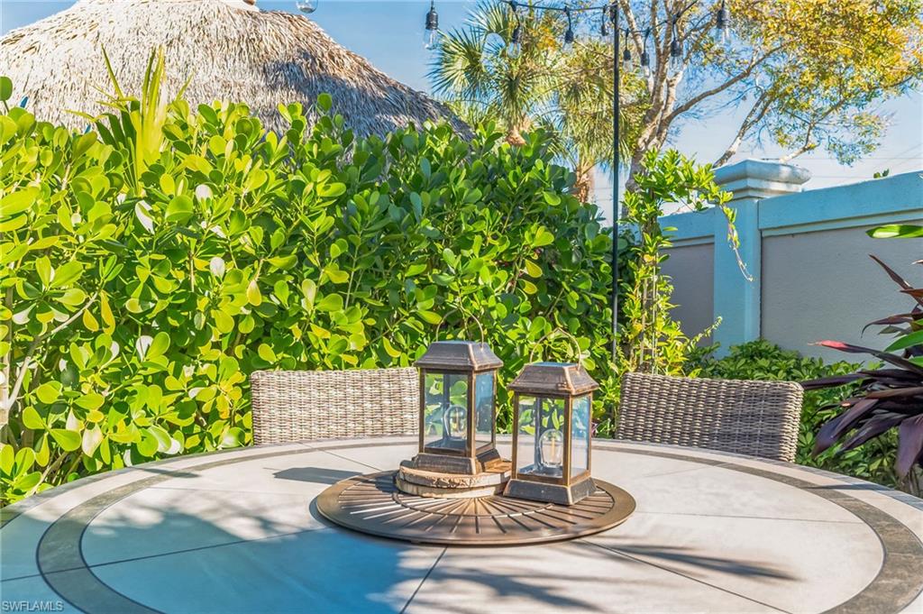 13575 Snook Circle Naples, FL 34114 - Photo 50 of 50 a vase of flowers sitting on a table