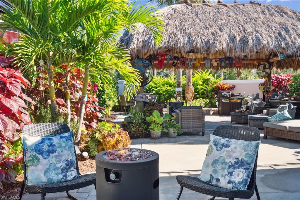 13575 Snook Circle Naples, FL 34114 - Photo 5 of 50 a living room filled with furniture and a garden