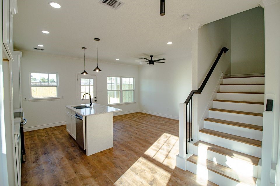1407 Odd Fellow Street, Unit A Conroe, TX 77301 - Photo 5 of 16 a view of entryway and hall with wooden floor