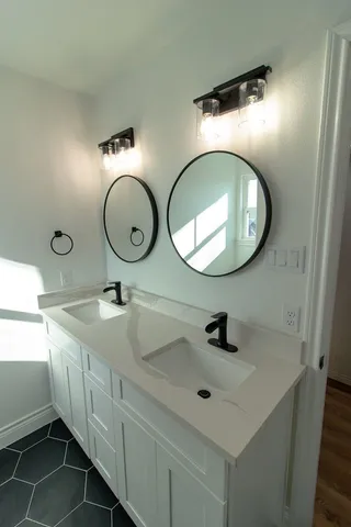 a bathroom with a sink and a mirror