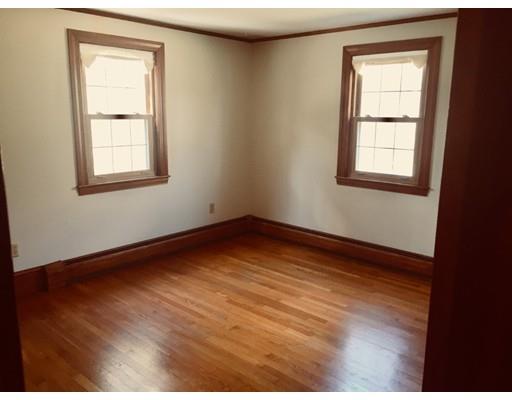 356 Neck Road Rochester, MA 02770 - Photo 5 of 11 a view of an empty room with wooden floor and a window