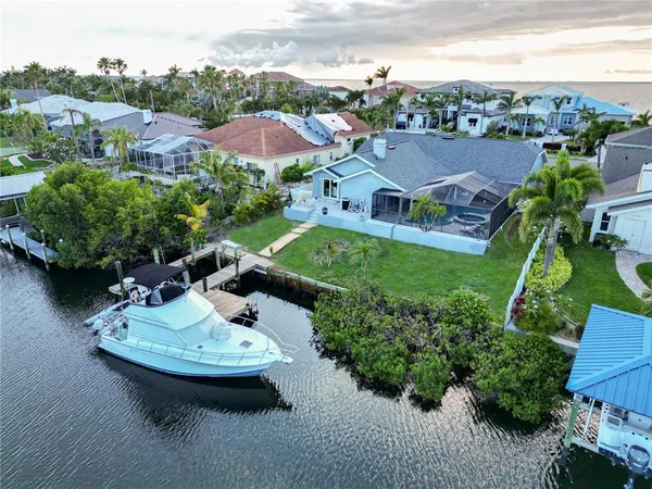 an aerial view of a house with garden space and street view