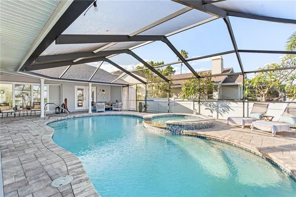 a view of a swimming pool with a patio