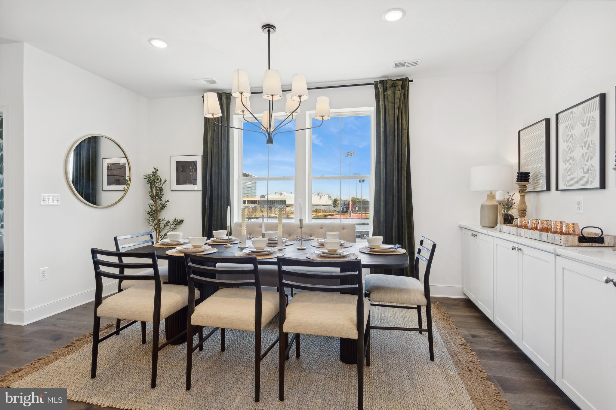 128 Locke Street, Unit 2029 Baltimore, MD 21230 - Photo 20 of 29 a dining room with furniture a chandelier and wooden floor