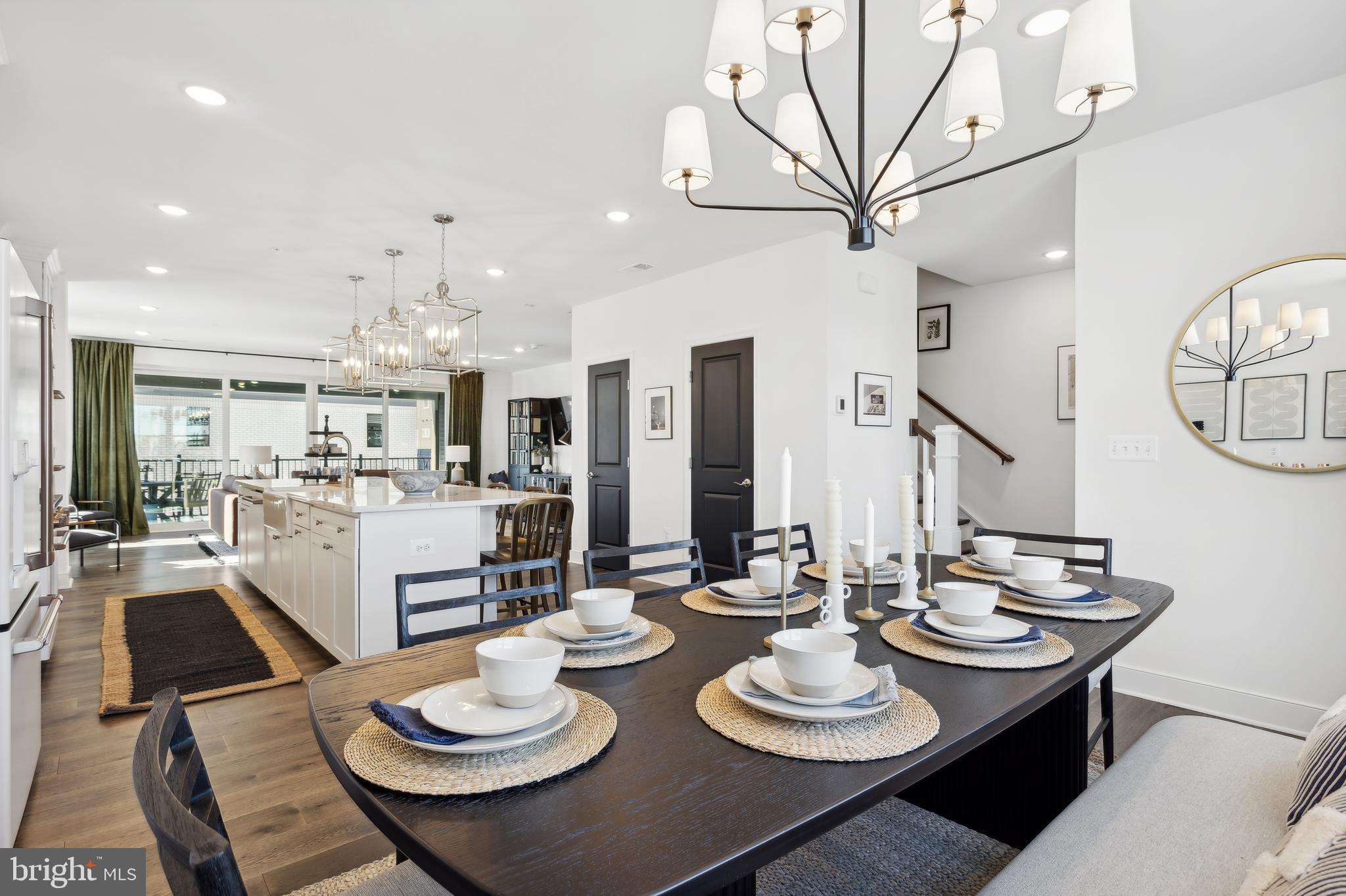 128 Locke Street, Unit 2029 Baltimore, MD 21230 - Photo 23 of 29 a kitchen with stainless steel appliances a dining table and chairs