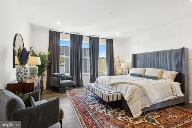 a bedroom with a bed and a couch