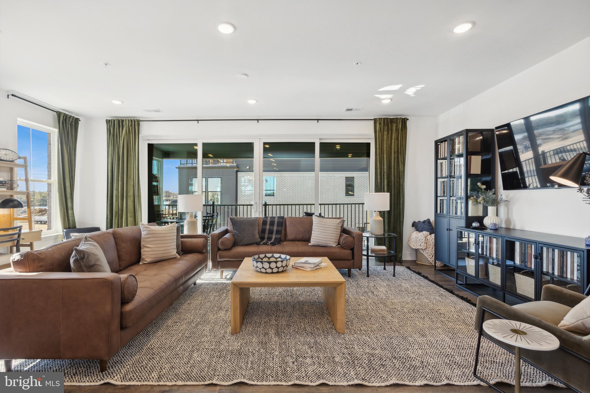 128 Locke Street, Unit 2029 Baltimore, MD 21230 - Photo 4 of 29 a living room with furniture and a large window