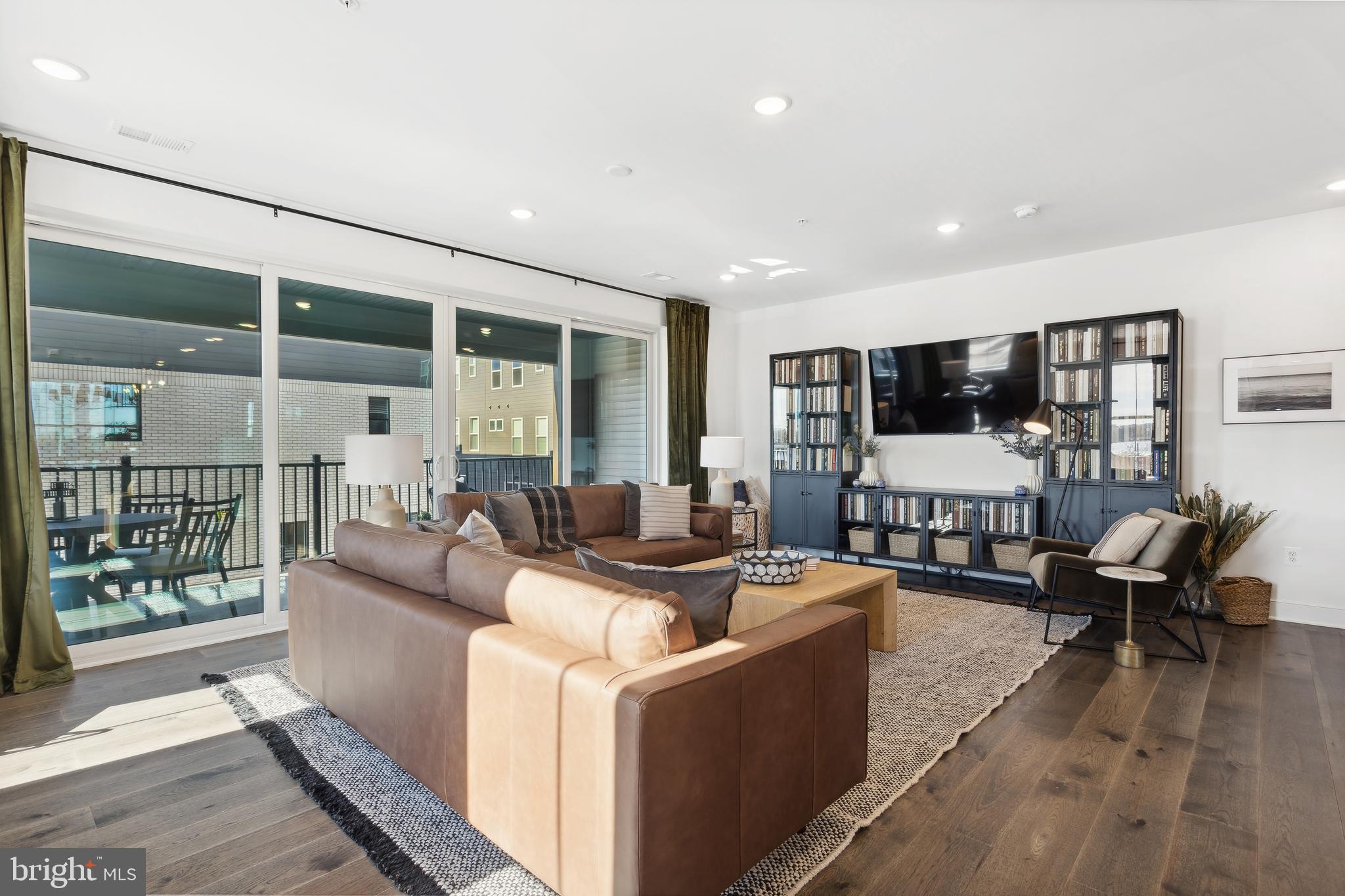 128 Locke Street, Unit 2029 Baltimore, MD 21230 - Photo 5 of 29 a living room with furniture and a large window