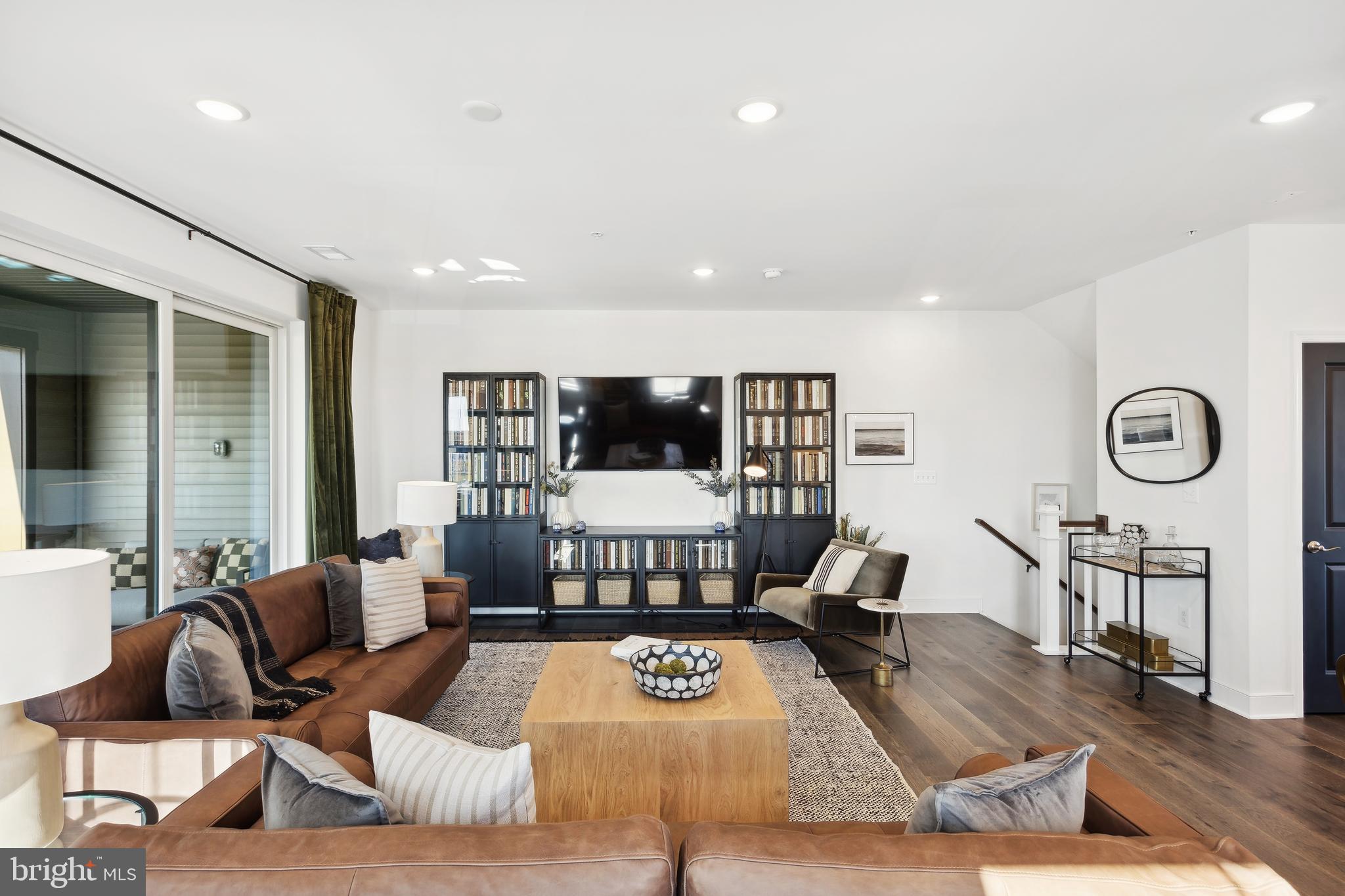 128 Locke Street, Unit 2029 Baltimore, MD 21230 - Photo 6 of 29 a living room with furniture and view of kitchen
