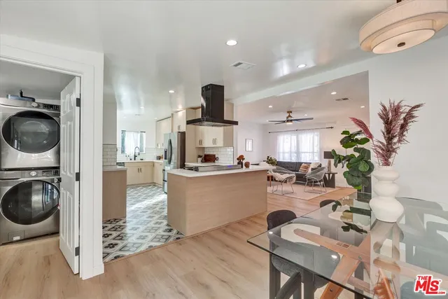 a kitchen with a table and chairs