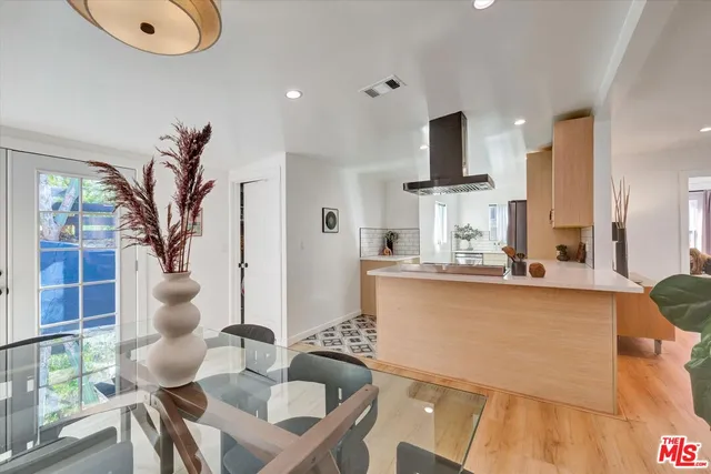 a kitchen with stainless steel appliances granite countertop a stove and a refrigerator