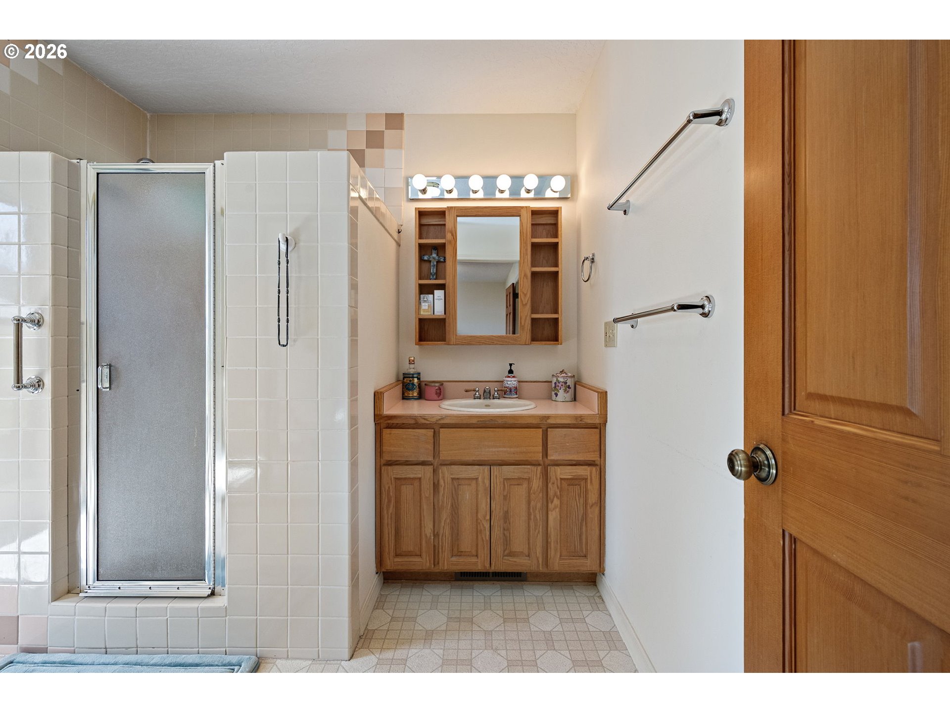 84 Green Lane Eugene, OR 97404 - Photo 23 of 41 a bathroom with a double vanity sink a mirror and a shower