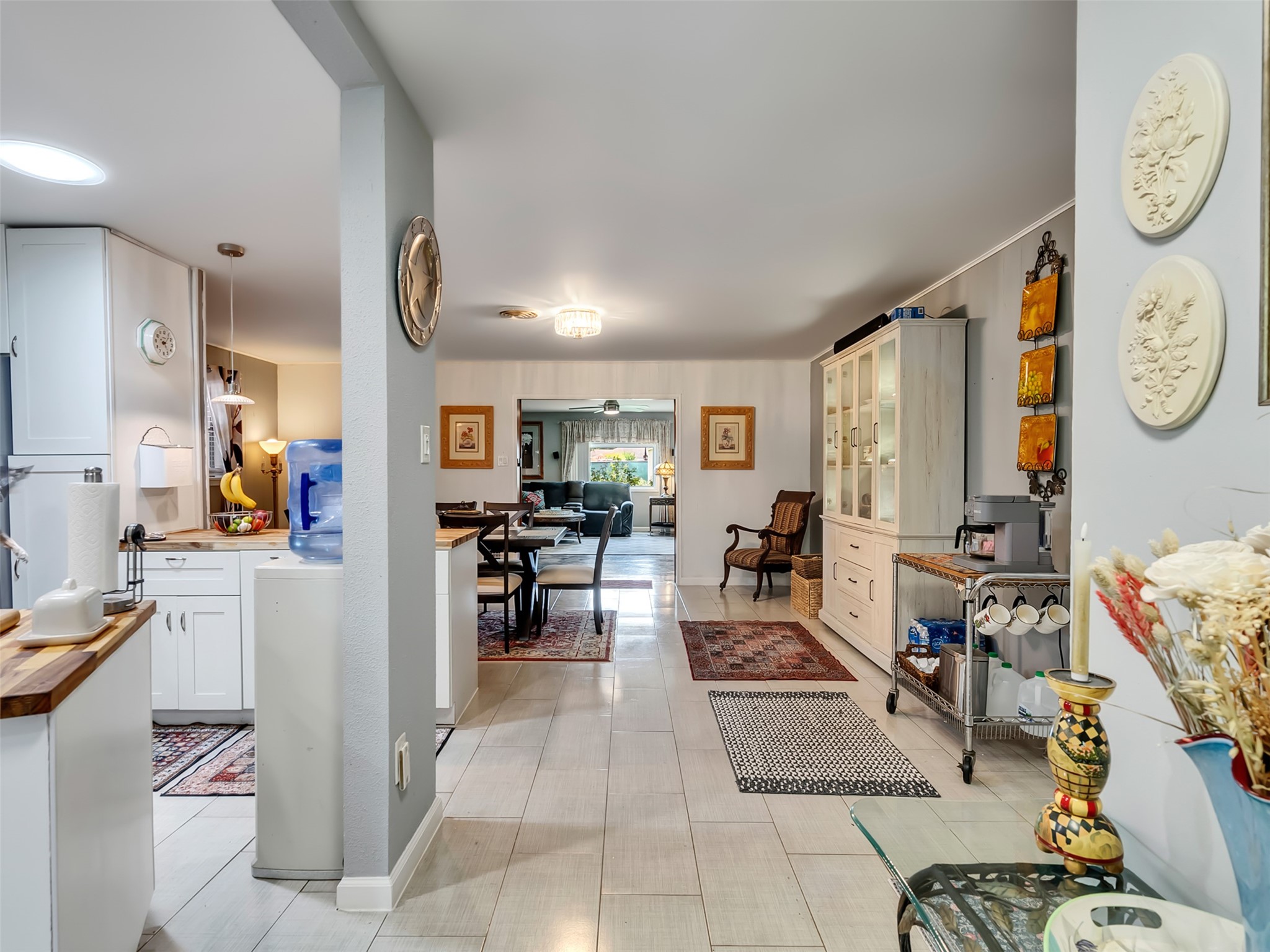 14310 Henry Road Houston, TX 77060 - Photo 7 of 34 Discover a charming open-plan living space that seamlessly blends cozy elegance with modern functionality, offering a warm and inviting atmosphere perfect for both relaxation and entertaining.