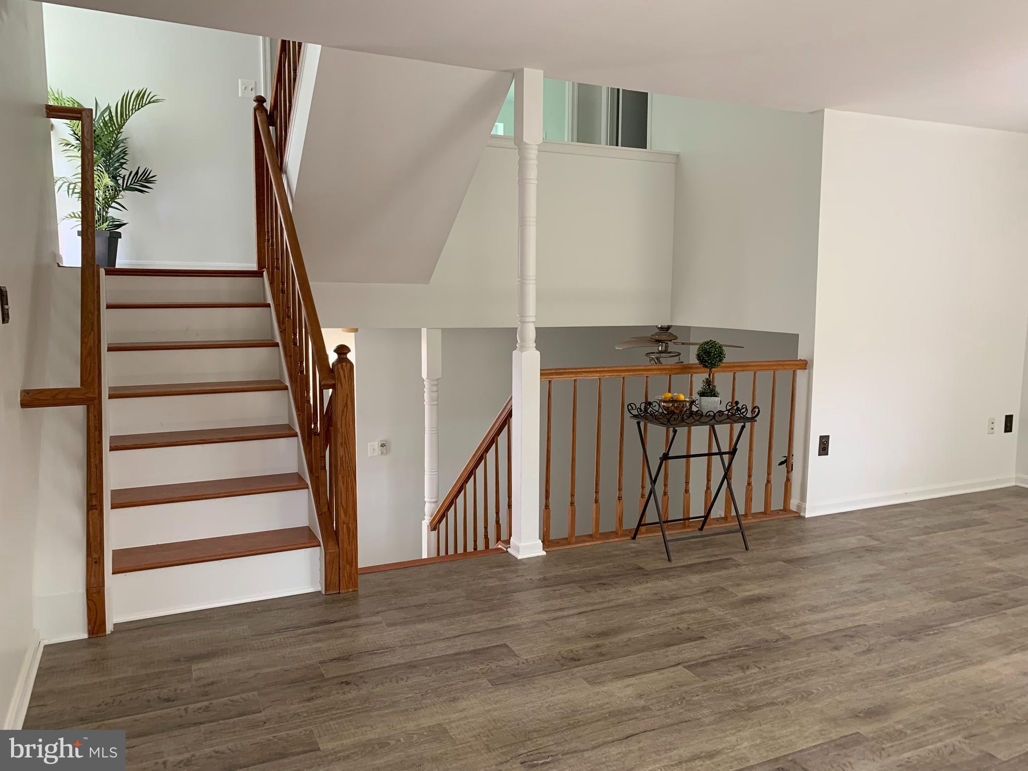 5478 Stavendish Street Burke, VA 22015 - Photo 21 of 24 a view of entryway and hall with wooden floor