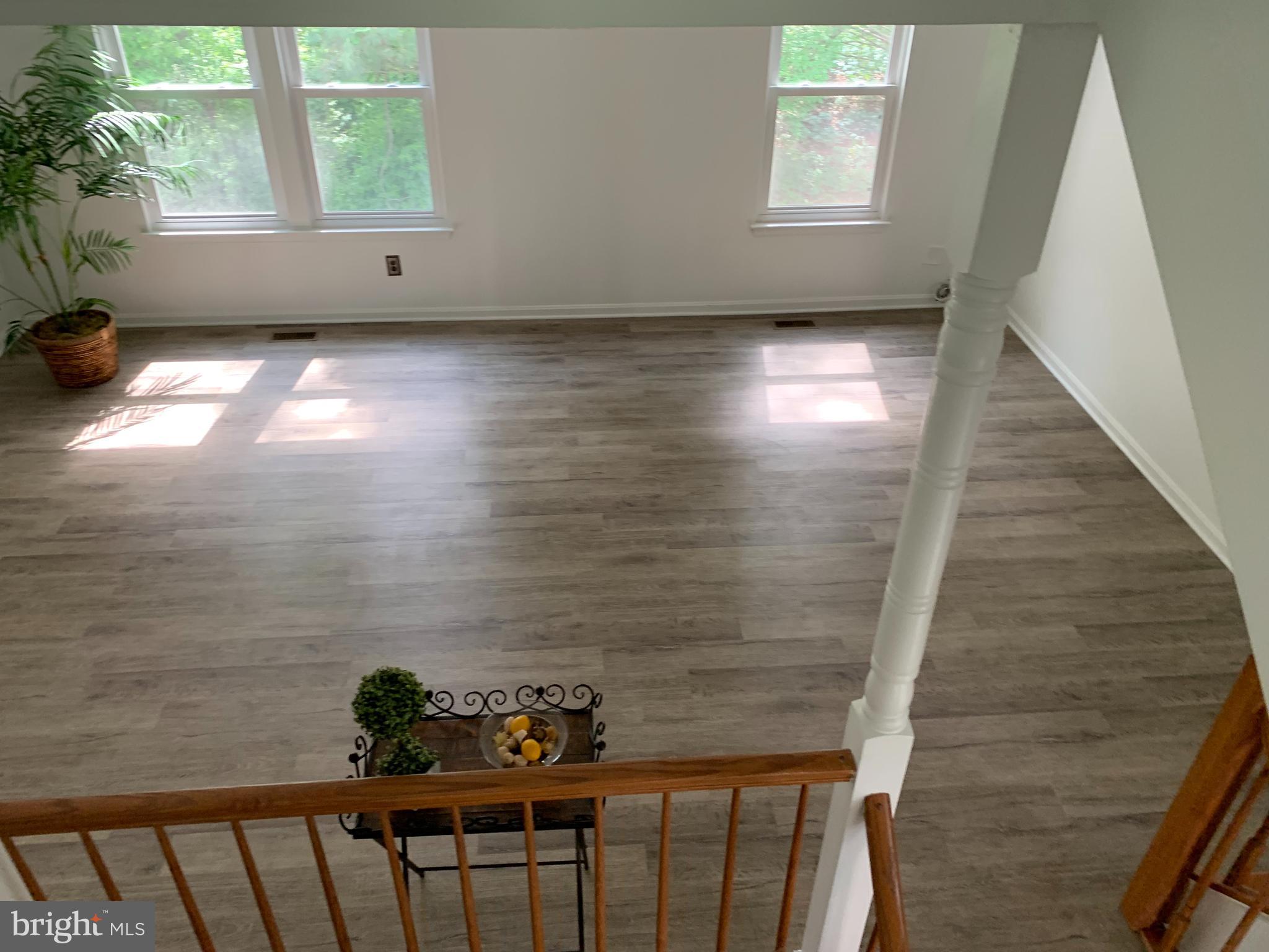 5478 Stavendish Street Burke, VA 22015 - Photo 23 of 24 a view of entryway with wooden floor