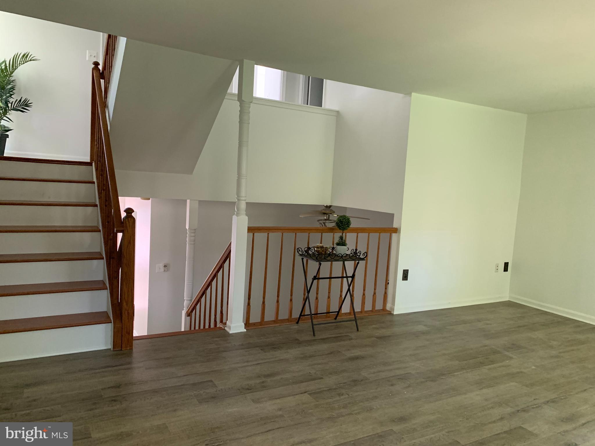 5478 Stavendish Street Burke, VA 22015 - Photo 10 of 24 a view of an empty room with wooden floor
