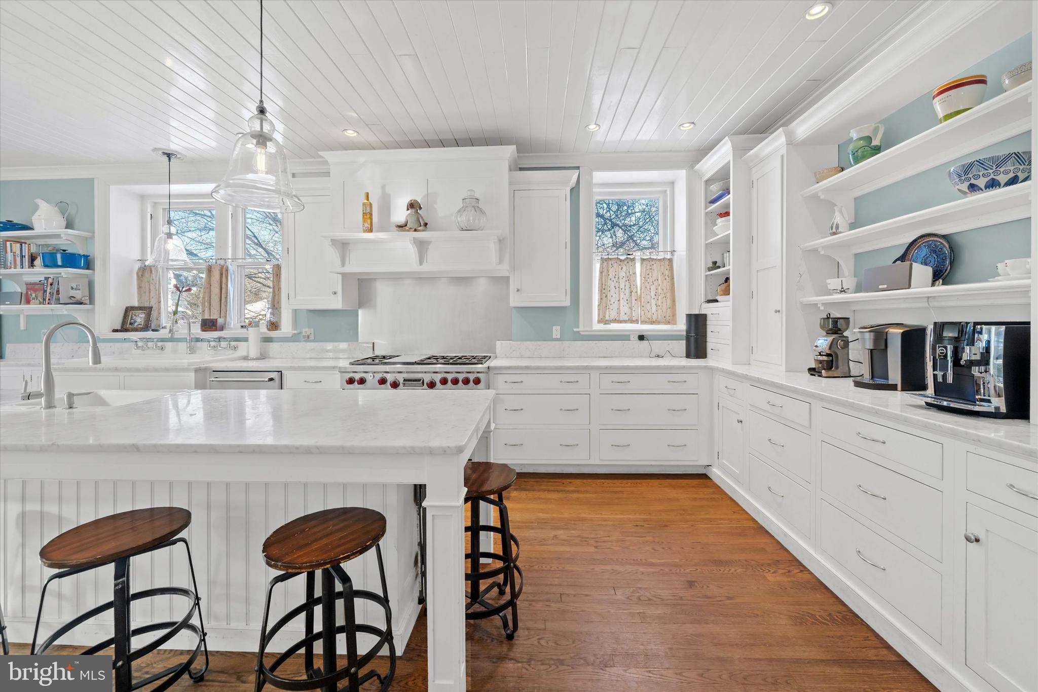 2412 Delaware Avenue Wilmington, DE 19806 - Photo 17 of 64 a kitchen with stainless steel appliances granite countertop a table chairs in it and wooden floors