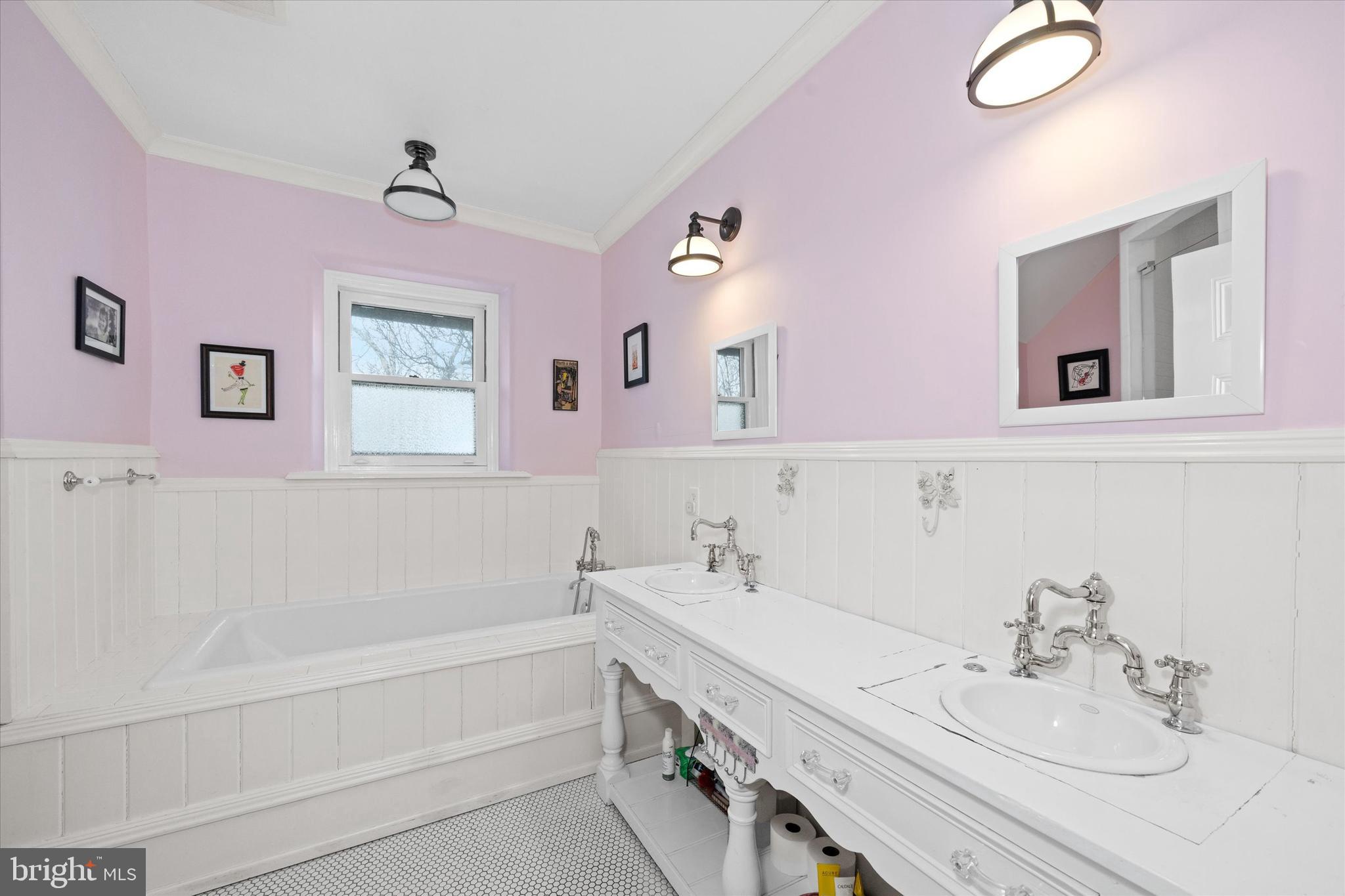 2412 Delaware Avenue Wilmington, DE 19806 - Photo 35 of 64 a bathroom with a tub sink and mirror