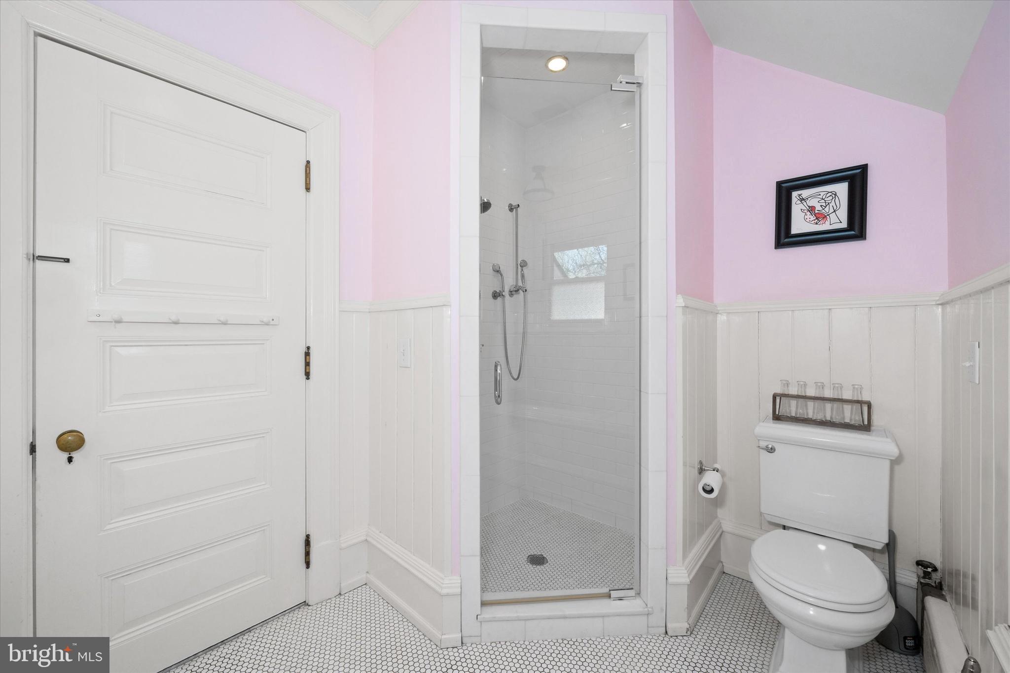 2412 Delaware Avenue Wilmington, DE 19806 - Photo 36 of 64 a bathroom with a shower a toilet and a sink