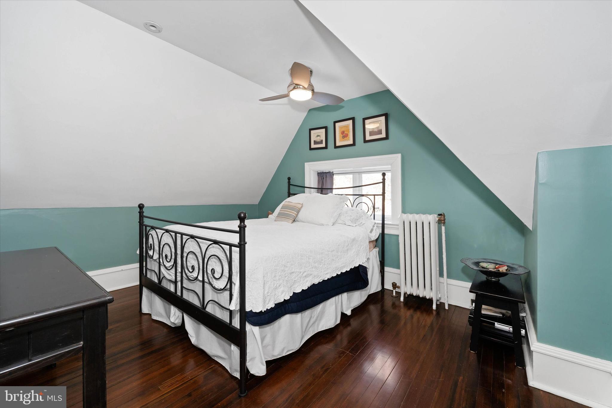 2412 Delaware Avenue Wilmington, DE 19806 - Photo 43 of 64 a bedroom with a bed and wooden floor