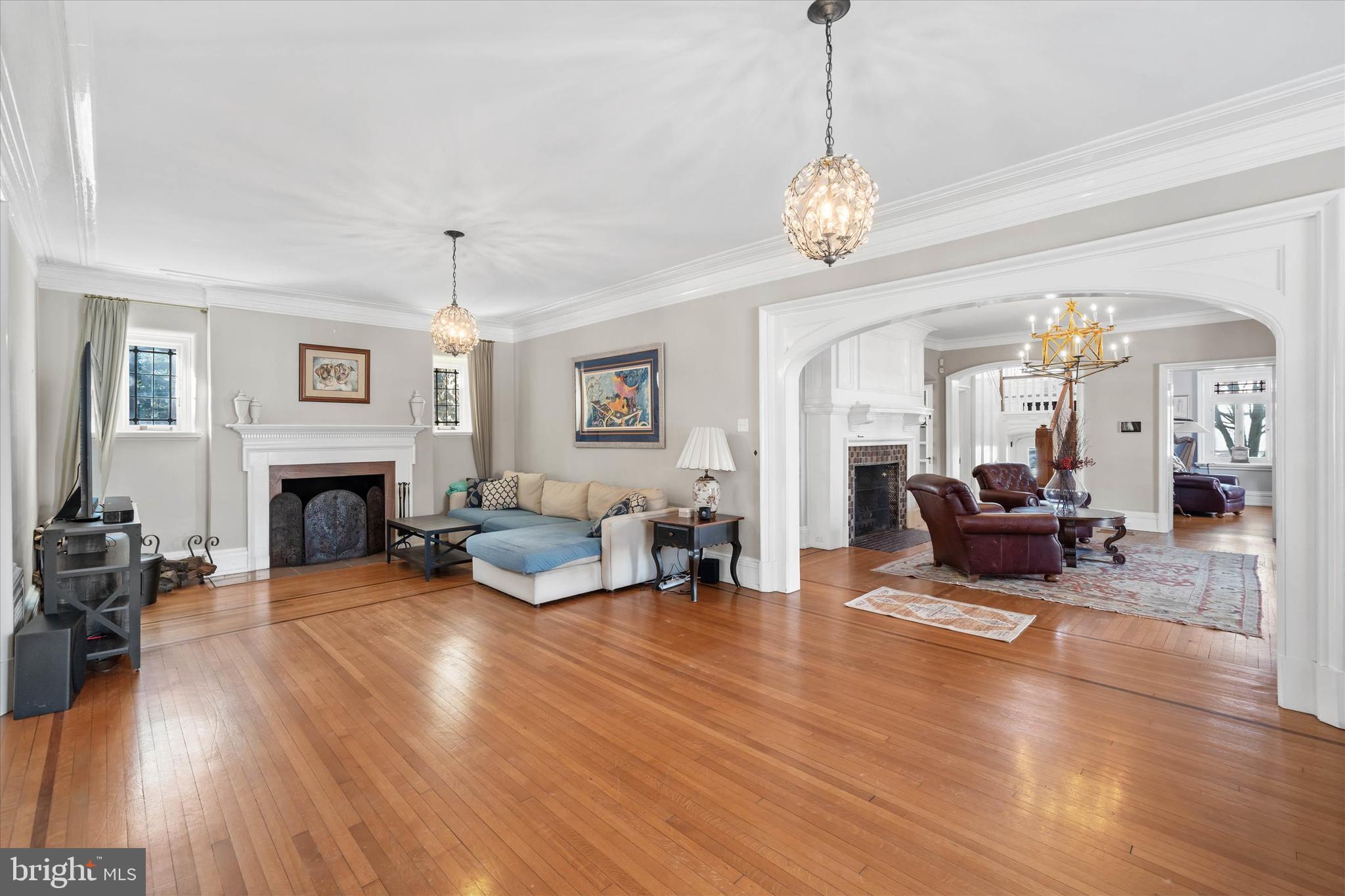 2412 Delaware Avenue Wilmington, DE 19806 - Photo 7 of 64 a living room with furniture a fireplace and wooden floor
