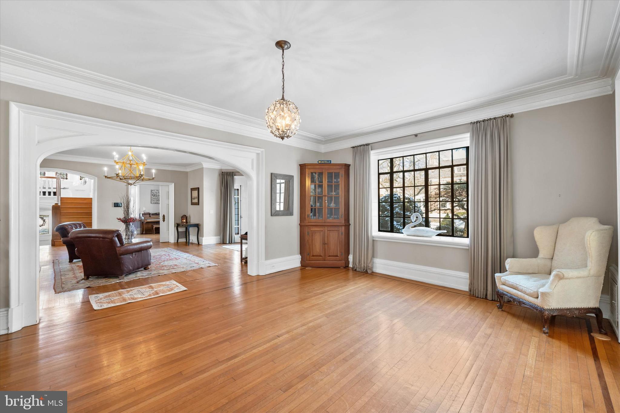 2412 Delaware Avenue Wilmington, DE 19806 - Photo 8 of 64 a view of a livingroom with furniture wooden floor windows and a chandelier