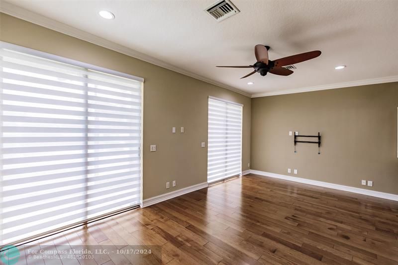 116 Southeast Crestwood Circle Stuart, FL 34997 - Photo 15 of 48 a view of a livingroom with a ceiling fan and window