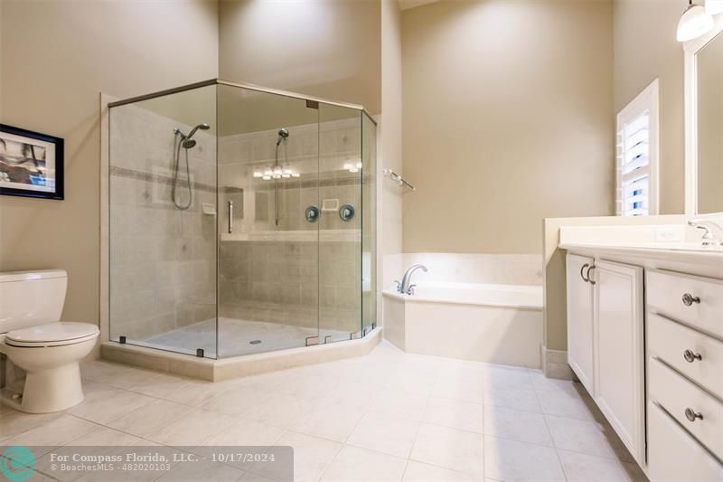 116 Southeast Crestwood Circle Stuart, FL 34997 - Photo 29 of 48 a bathroom with a shower a toilet and a sink