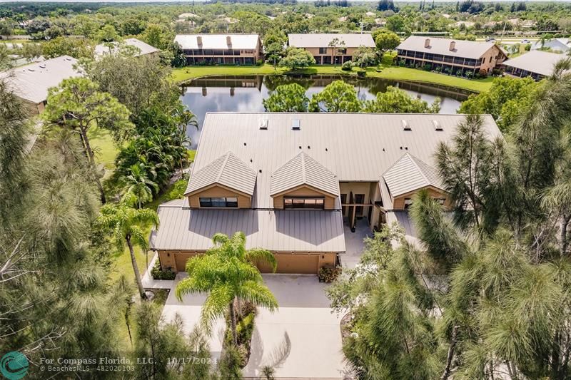 116 Southeast Crestwood Circle Stuart, FL 34997 - Photo 3 of 48 an aerial view of residential houses with outdoor space and parking