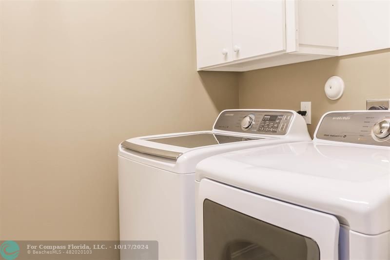 116 Southeast Crestwood Circle Stuart, FL 34997 - Photo 32 of 48 a utility room with dryer and washer