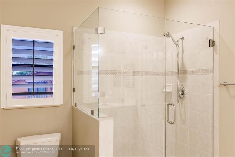 116 Southeast Crestwood Circle Stuart, FL 34997 - Photo 37 of 48 a bathroom with a shower and a window