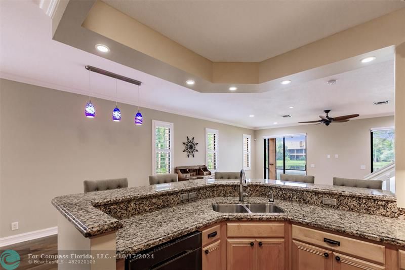 116 Southeast Crestwood Circle Stuart, FL 34997 - Photo 8 of 48 a kitchen with granite countertop a sink and cabinets