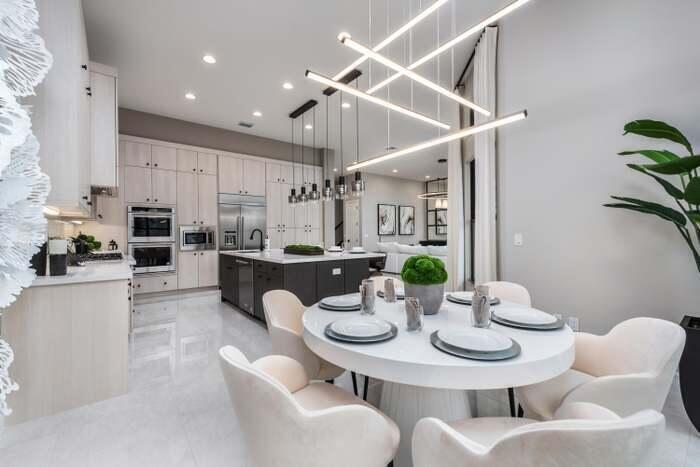 17166 Ludovica Lane Boca Raton, FL 33496 - Photo 4 of 24 a view of a dining room with furniture and wooden floor