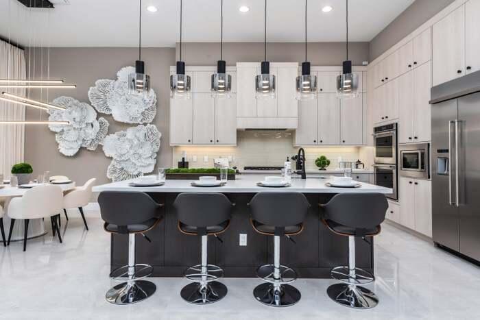 17166 Ludovica Lane Boca Raton, FL 33496 - Photo 5 of 24 a kitchen with a dining table chairs sink and kitchen view