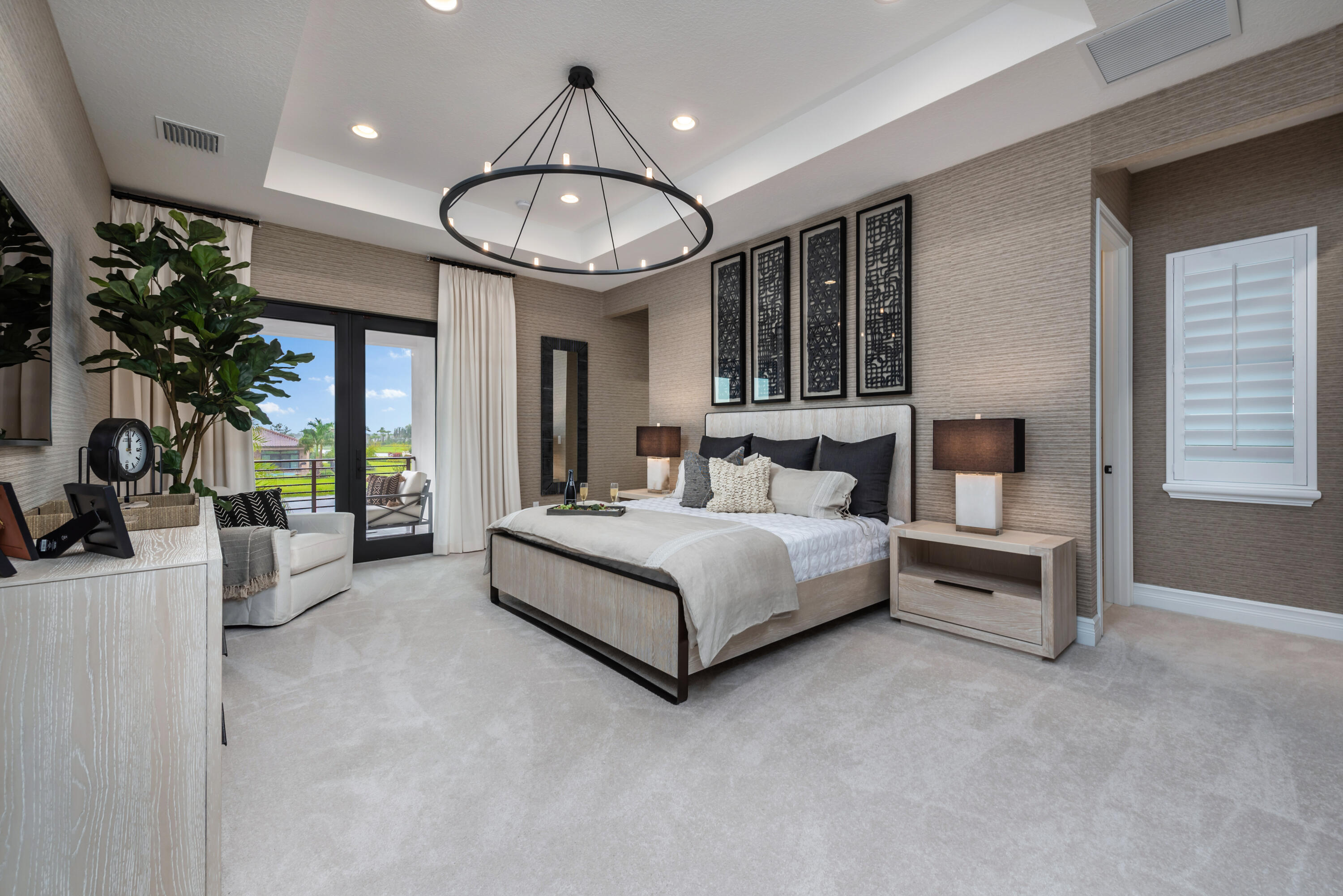 17166 Ludovica Lane Boca Raton, FL 33496 - Photo 7 of 24 a bedroom with a large bed and a chandelier