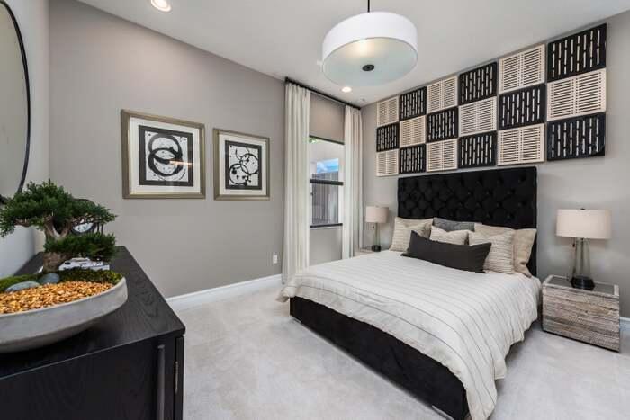 17166 Ludovica Lane Boca Raton, FL 33496 - Photo 9 of 24 a bedroom with a bed and a potted plant