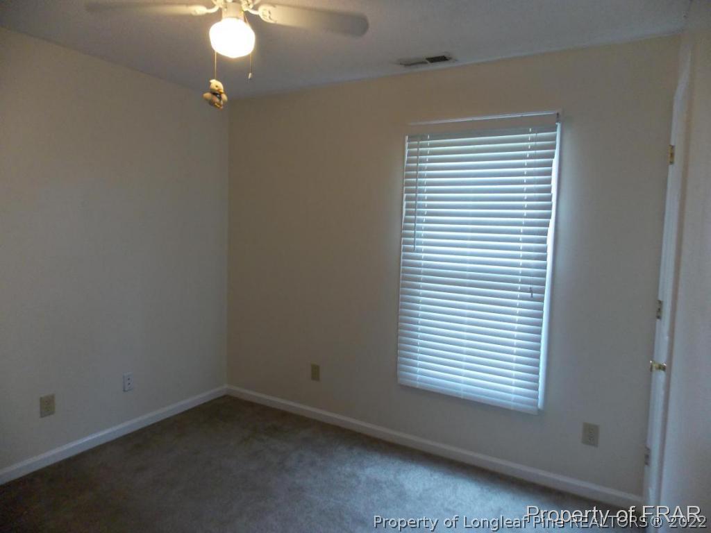 10071 Rockfish Road Raeford, NC 28376 - Photo 12 of 15 an empty room with a window